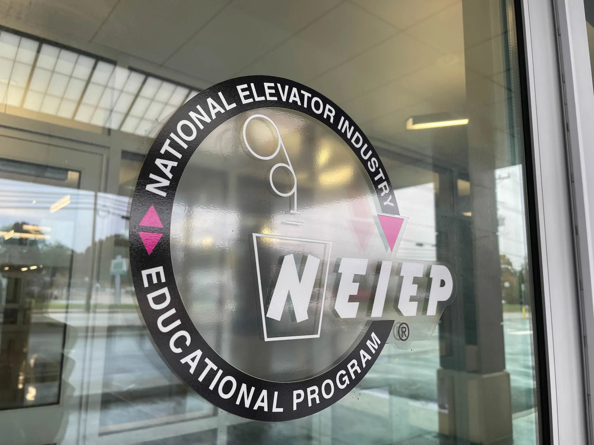 NEIEP logo on the headquarters building in Warwick